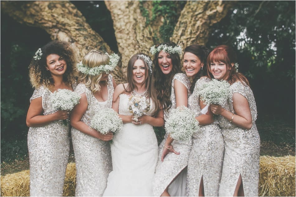 Bridebook.co.uk- bride and bridesmaids in sequenced dresses laughing