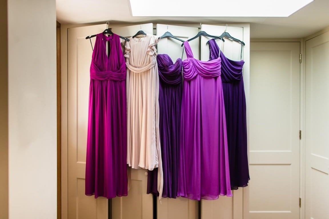 Bridebook.co.uk- mismatched bridesmaids dresses hanging up