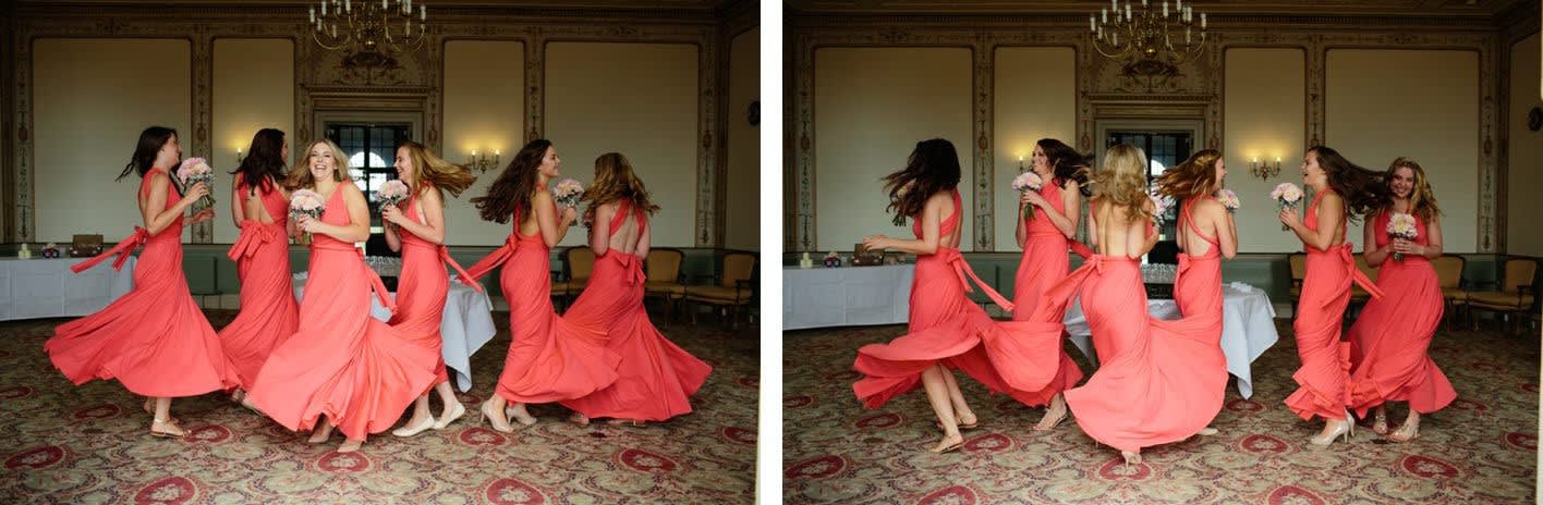 Bridebook.co.uk- bridesmaids in coral dresses twirling