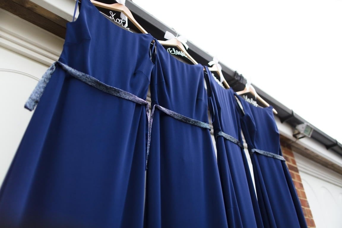 Bridebook.co.uk- navy bridesmaid dresses on customised hangers