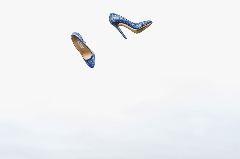 Bridebook.co.uk- blue wedding shoes thrown into the air