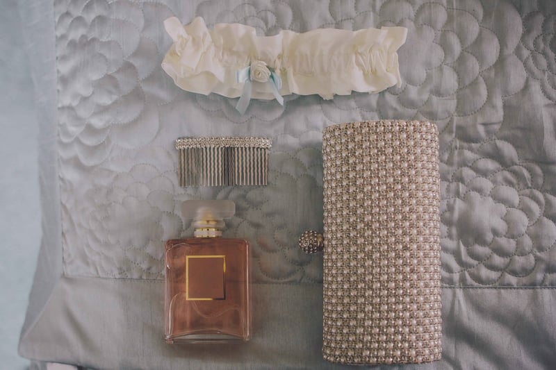 Bridebook.co.uk- bridal purse perfume hair grip and garter laid out