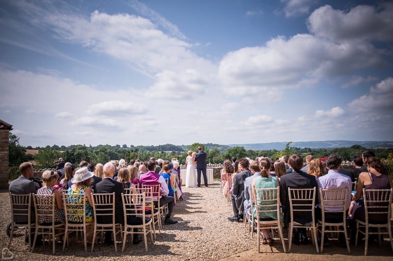 outdoor wedding ceremony going on at folly farm wedding venue