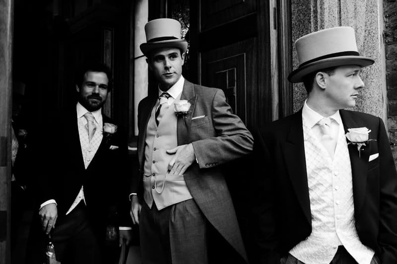 Bridebook.co.uk- groom and ushers in morning suits and top hats