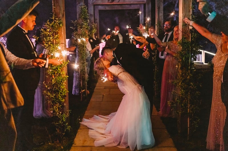 Faye and Adam Hughes in the church getting married