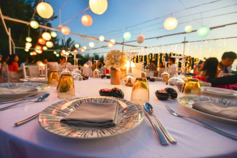 Evening dinner for a wedding with decorative lights