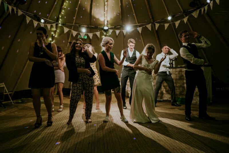 Bride and guests dancing at a wedding party