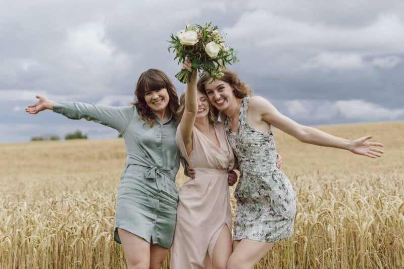 Bride and friends in a field