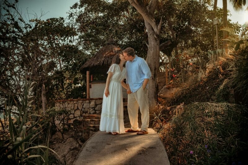 Kissing couple under the trees