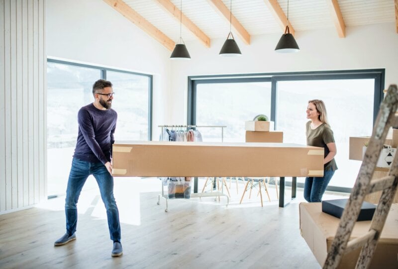 Couple holding a large box