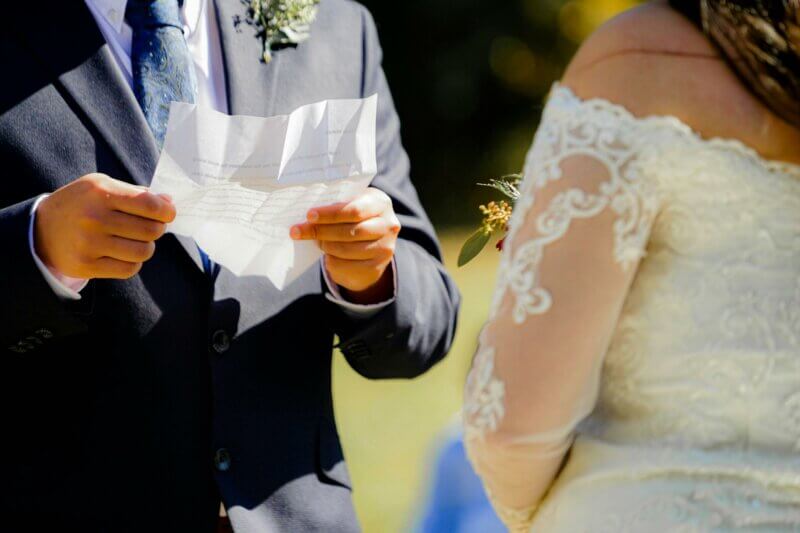 Groom reading his vows