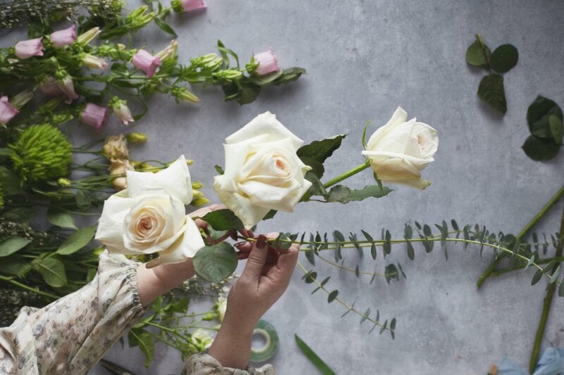 Someone making a flower arrangement