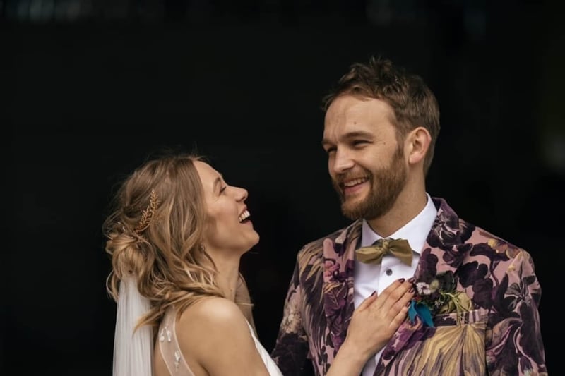 bride and groom laughing at their wedding