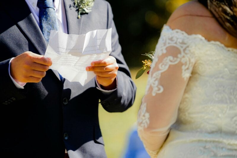Groom reading his vows