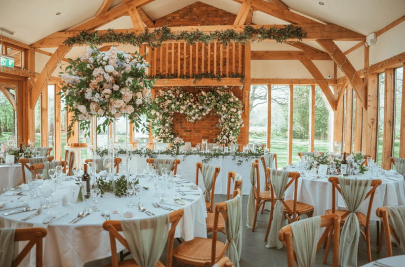 Interior of a wedding breakfast room at a UK barn wedding venue