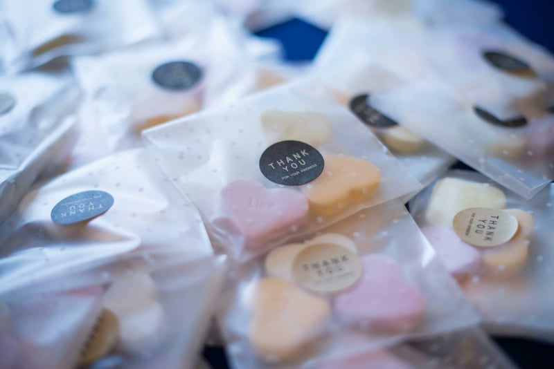 small plastic bags of heart shaped sweets with thank you notes