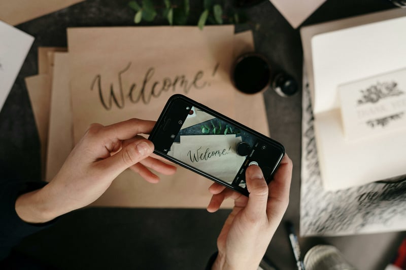 Wedding guest taking a photo of details with their photo