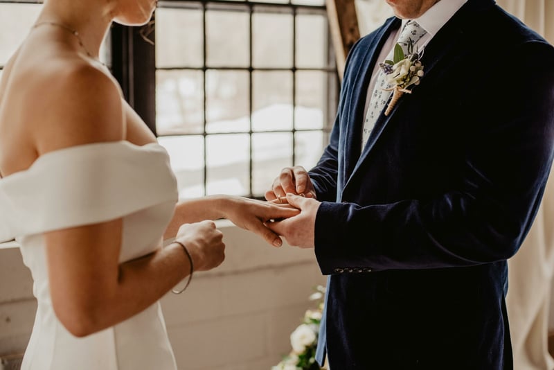 Bride and groom holding hands during a wedding ceremony