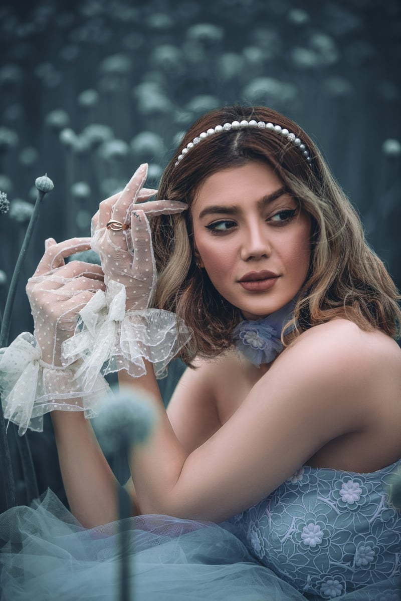 Bride with a pearl hairband and wrist length lace wedding gloves
