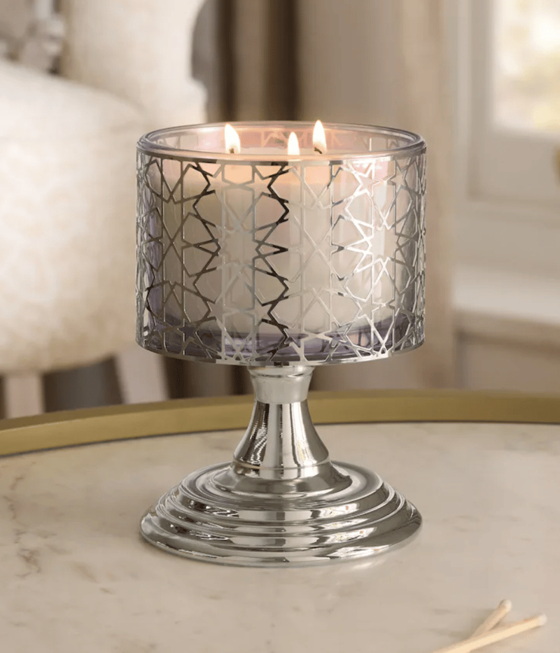 candle in a silver star holder