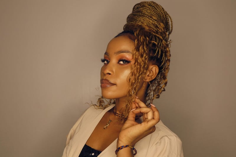 woman with braided hair in a bun