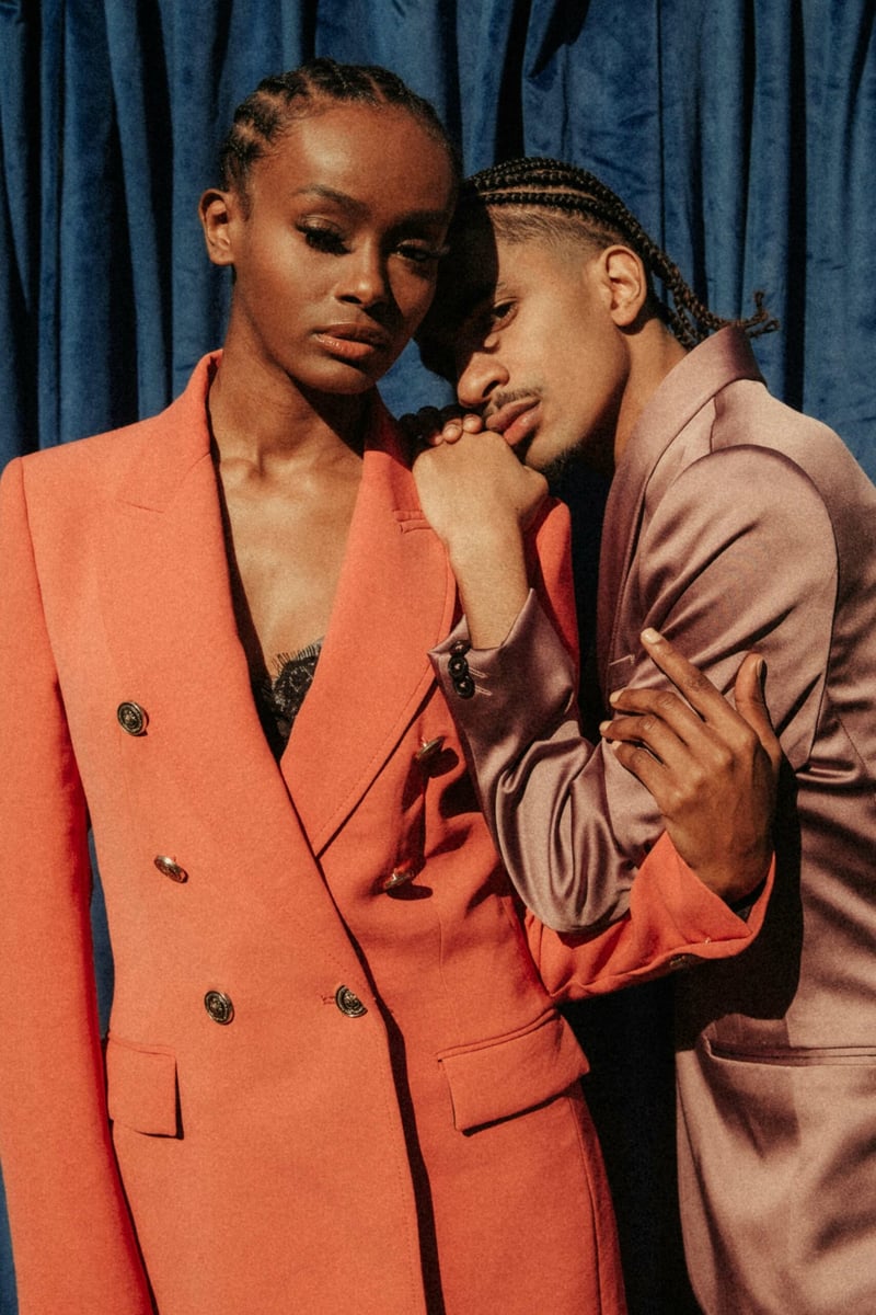 couple wearing coordinated wedding suits