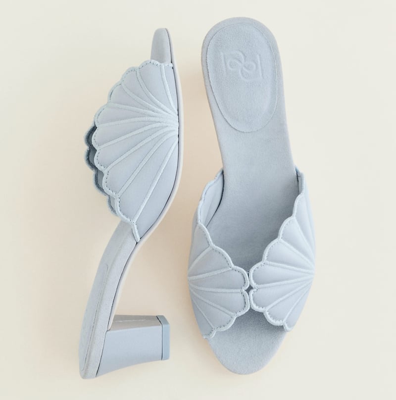 a pair of pale blue mule wedding shoes with scalloped peeptoe detail