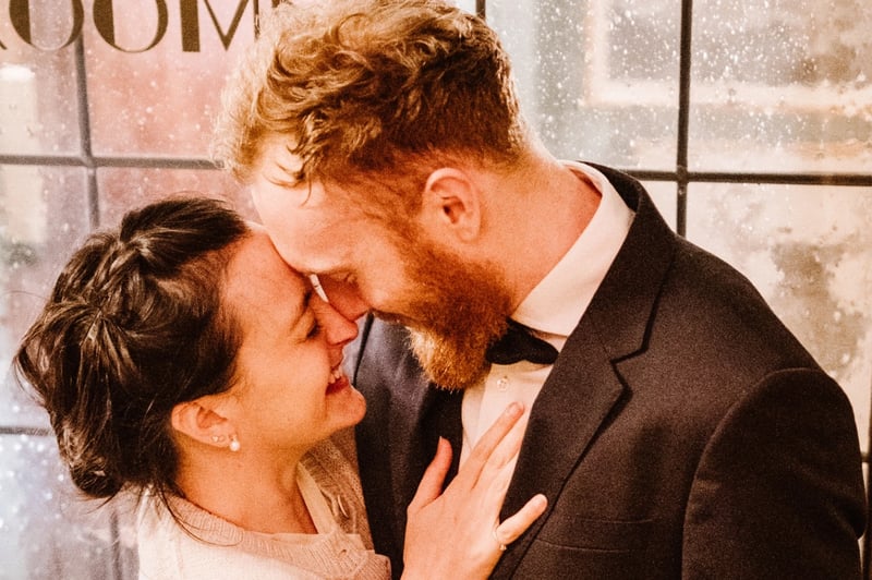 couple kissing on their wedding day