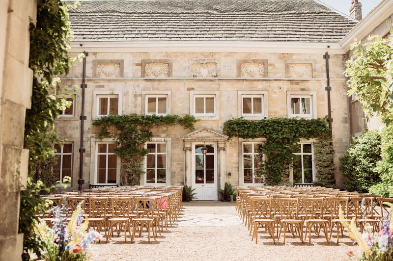 exterior of a country house wedding venue in Sussex set up for an outdoor ceremony.