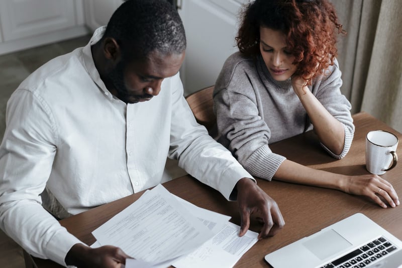 Couple reviewing paperwork together