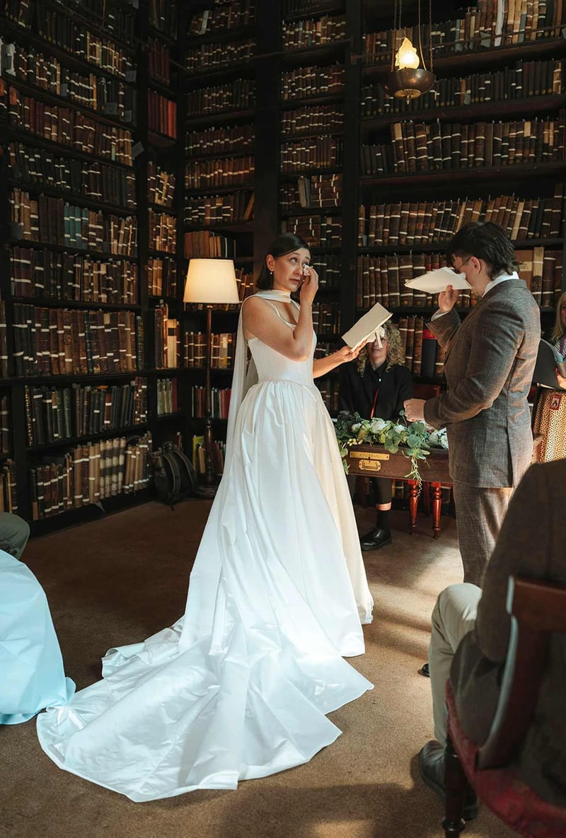 Bride wiping away a tear during a wedding reading