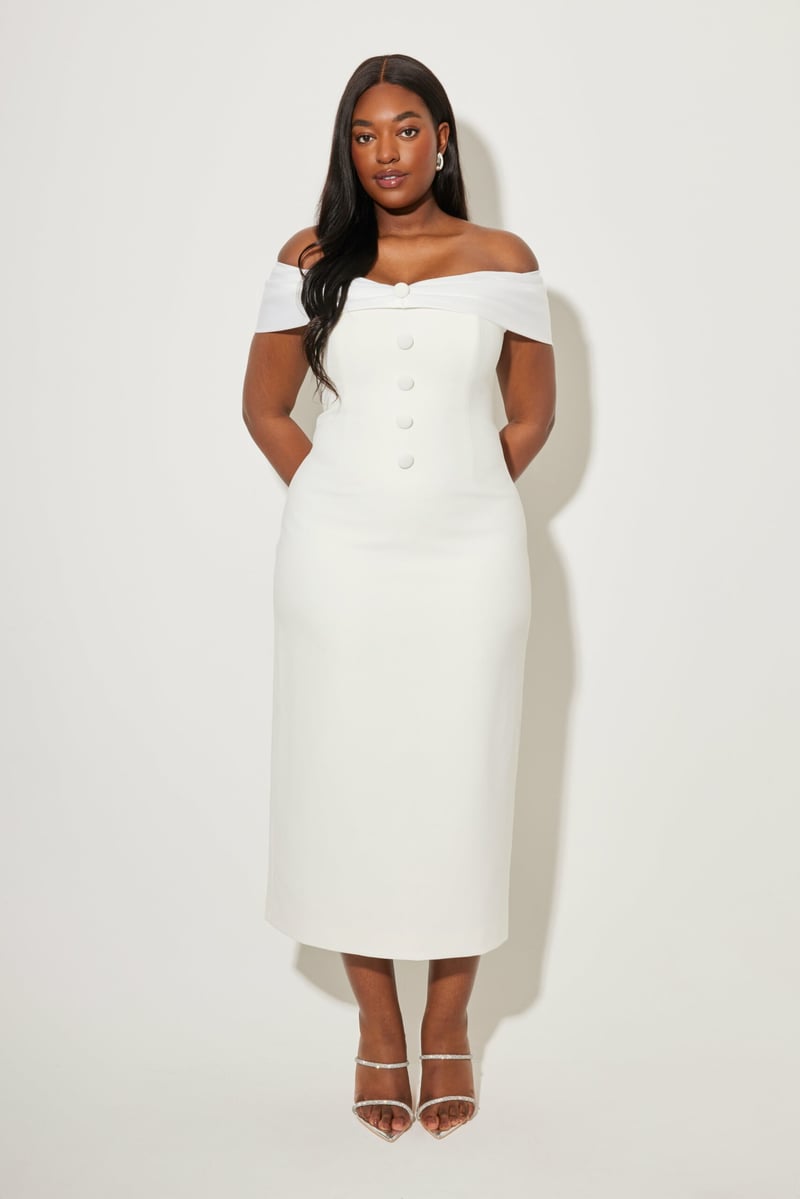 a model wearing a white midi wedding dress with bardot neckline and button detail down the front.