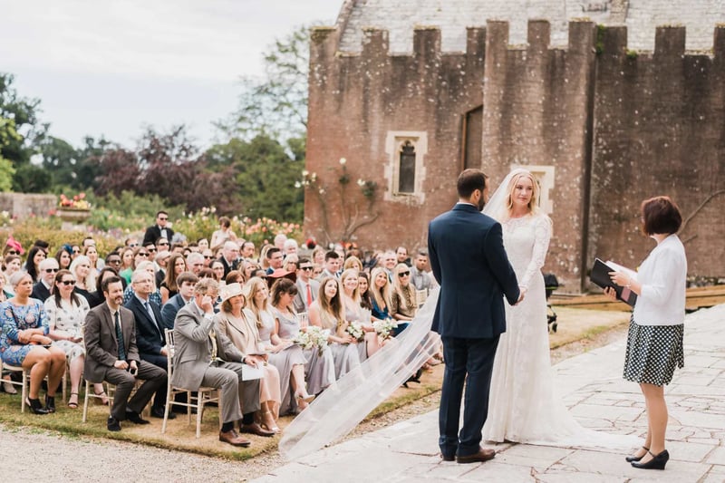 Outdoor wedding ceremony being let by an officiant