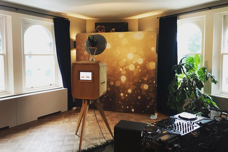 wedding photobooth against a sparkling gold background 