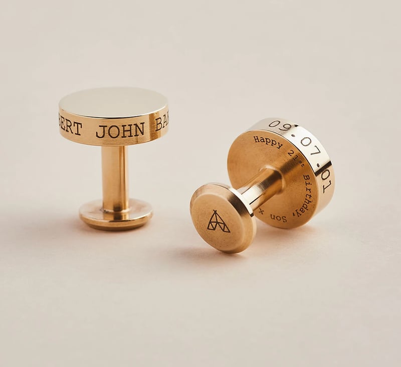Brass cufflinks engraved with an anniversary date