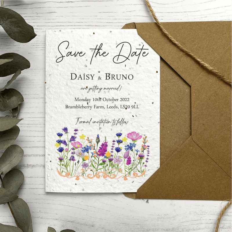 a rustic floral print save-the-date card with brown envelope.
