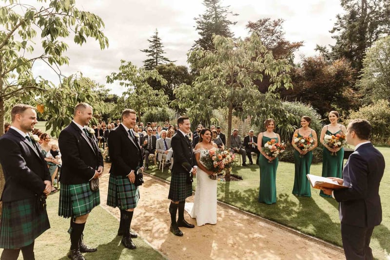 Celebrant led wedding ceremony outside a castle wedding venue in scotland