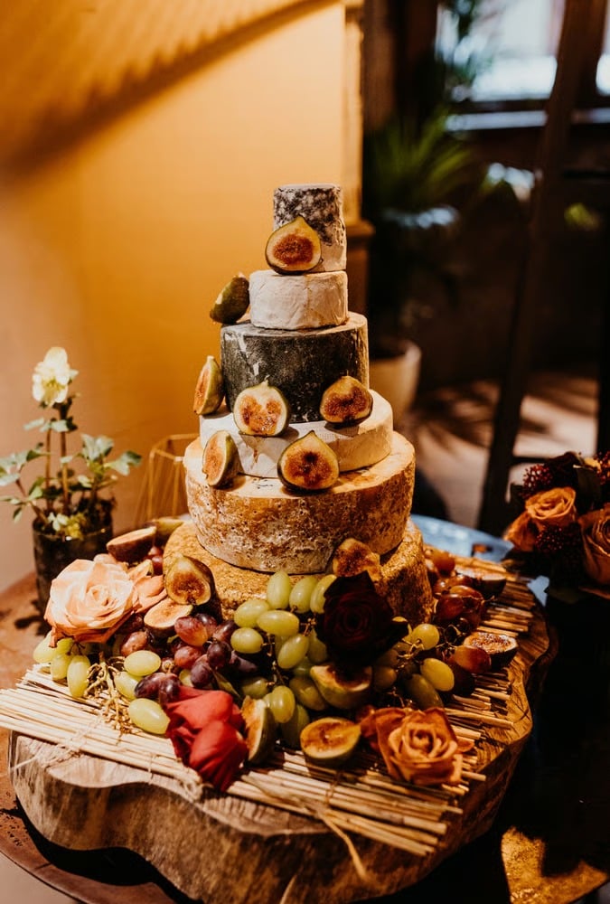 Savoury wedding cake made up of stacked wheels of cheese