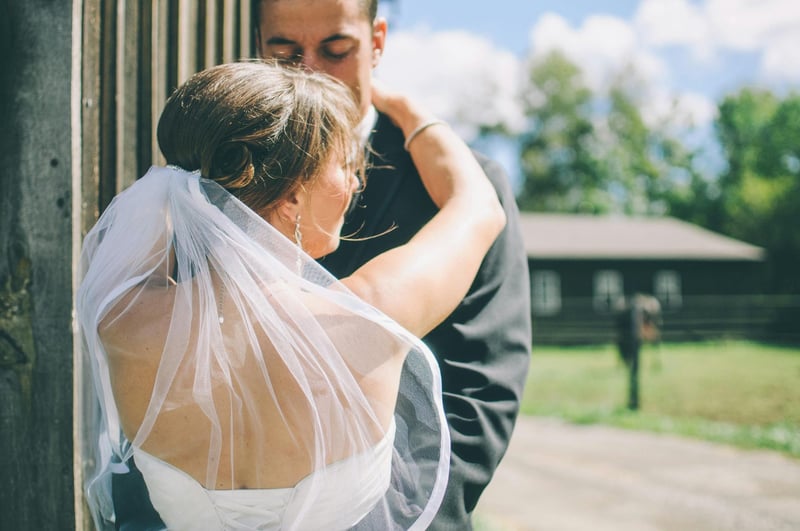 Bride and groom embracing outdoors at a canadian wedding