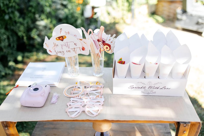 a table with DIY photo props and a polaroid camera 