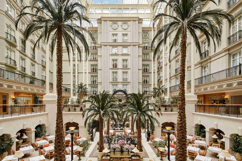 Interior of Landmark Hotel London with tall palm trees