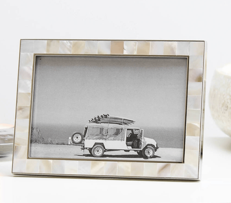 mother of pearl photo frame holding a photo of a car