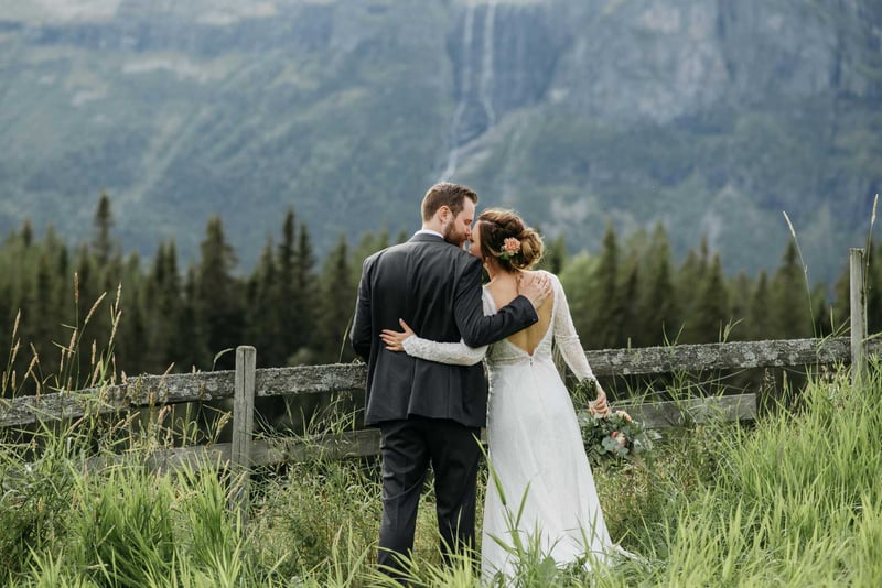 A bride and groom embracing at a wedding in the rocky mountains in canada