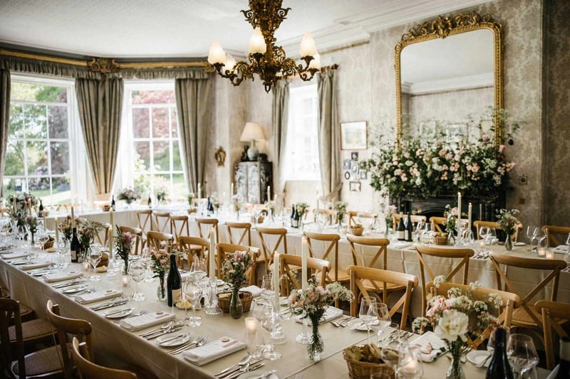 Wedding reception interior at homme house with long banquet tables