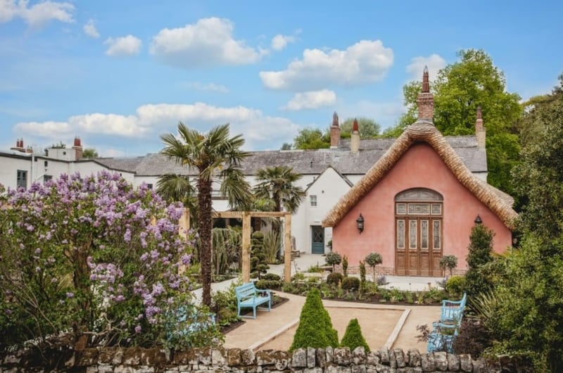 the exterior of the wedding venue with exotic plants surrounding