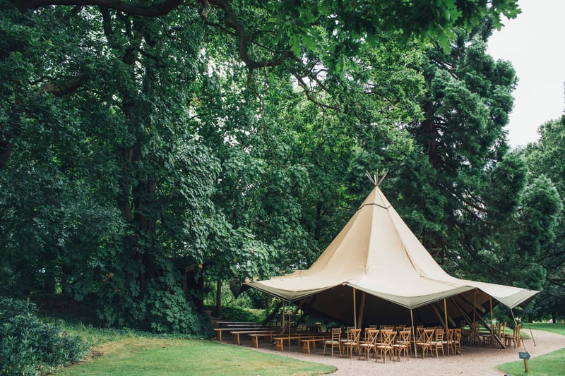 a ceremony set-up underneath a tipi tent.