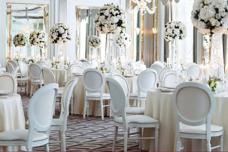 Glamorous white wedding reception set up at London wedding venue Claridge's