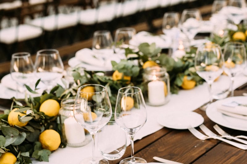 wedding table setting with lemons on it