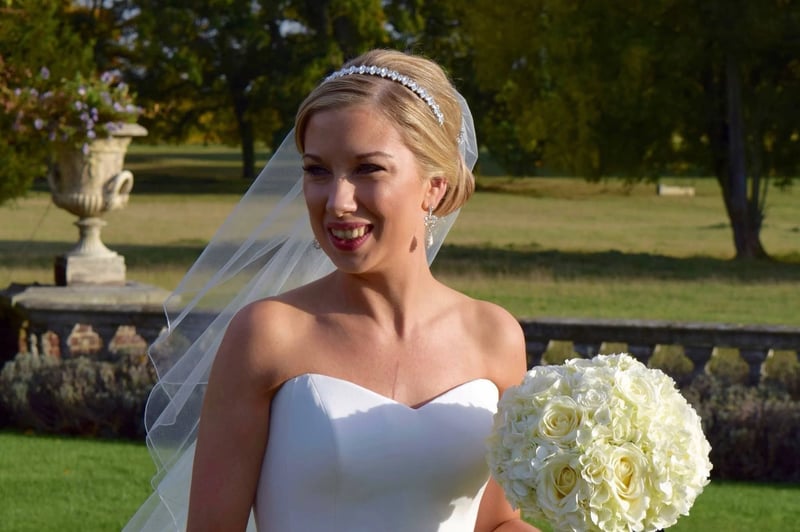 blonde bride in a strapless dress wearing a tiara 