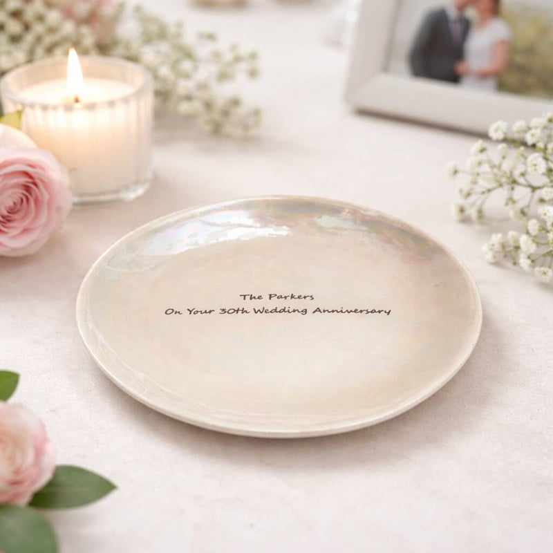 a pearl plate with a 30th wedding anniversary message engraved onto it
